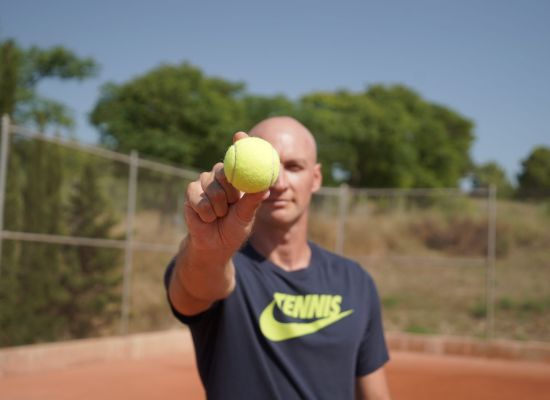 Learn to focus on the ball when playing tennis.